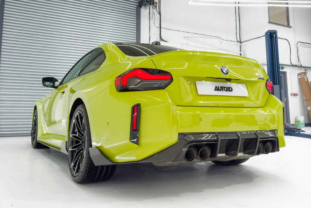 TREVORA G87 M2 carbon rear bumper winglet set installed on a BMW G87 M2 exterior upgrade for improved aerodynamics.