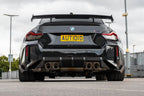 TREVORA G87 M2 carbon rear bumper winglet set installed on car's exterior, enhancing aerodynamics and sporty appearance.