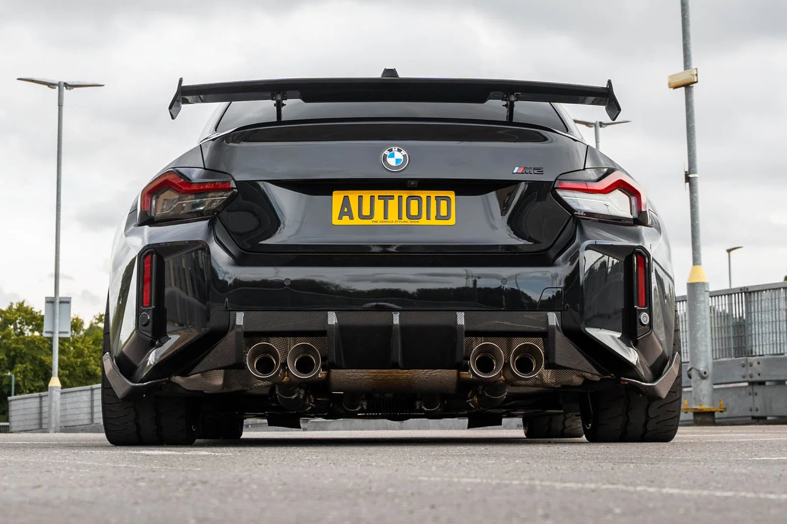 TREVORA G87 M2 carbon rear bumper winglet set installed on car's exterior, enhancing aerodynamics and sporty appearance.