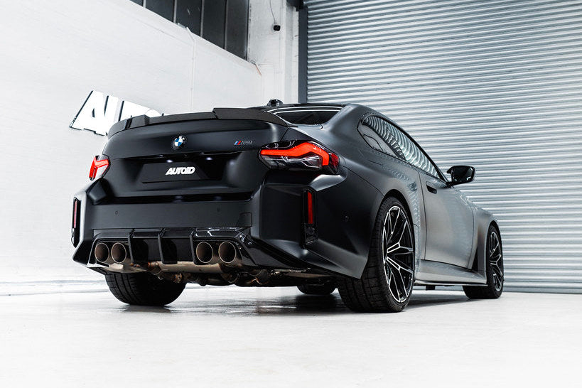 TREVORA G87 M2 TR87 Carbon Rear Diffuser installed on exterior of BMW M2, showcasing aerodynamic performance and sleek design