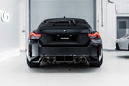TREVORA G87 M2 TR87 carbon rear diffuser installed on a car, highlighting sleek exterior design and lightweight aerodynamic features.