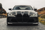 TREVORA G8X M3 M4 carbon fiber front splitter installed on vehicle, showcasing sleek exterior design and aerodynamic enhancement.