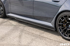 TREVORA BMW G90 G99 M5 PR-1 carbon exterior side skirts installed on the vehicle.