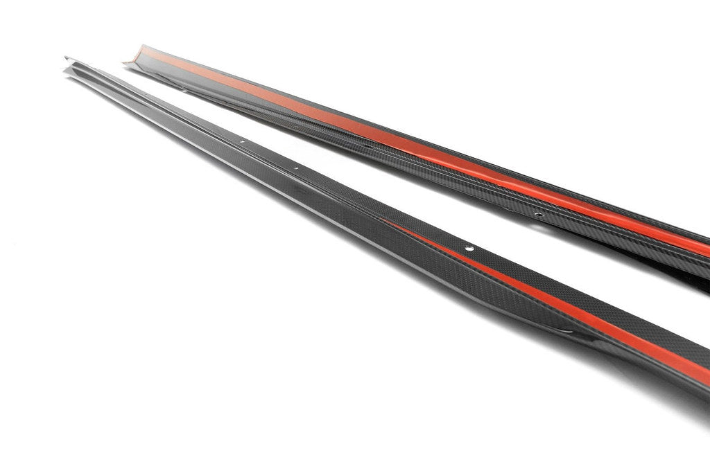 TREVORA G90 G99 M5 Carbon Fiber PR-1 Side Skirts installed on a car, showcasing sleek white exterior exterior accessories.