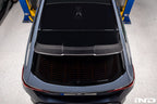 TREVORA G99 M5 carbon fiber rear roof spoiler installed on a vehicle, showcasing sleek exterior design and aerodynamic enhancements.