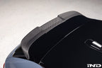 TREVORA G99 M5 Carbon Fiber PR-1 rear roof spoiler installed on a car, showcasing sleek, aerodynamic exterior design.