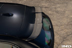 TREVORA G99 M5 Carbon Fiber Rear Roof Spoiler installed on vehicle, showing sleek exterior design and aerodynamic features.