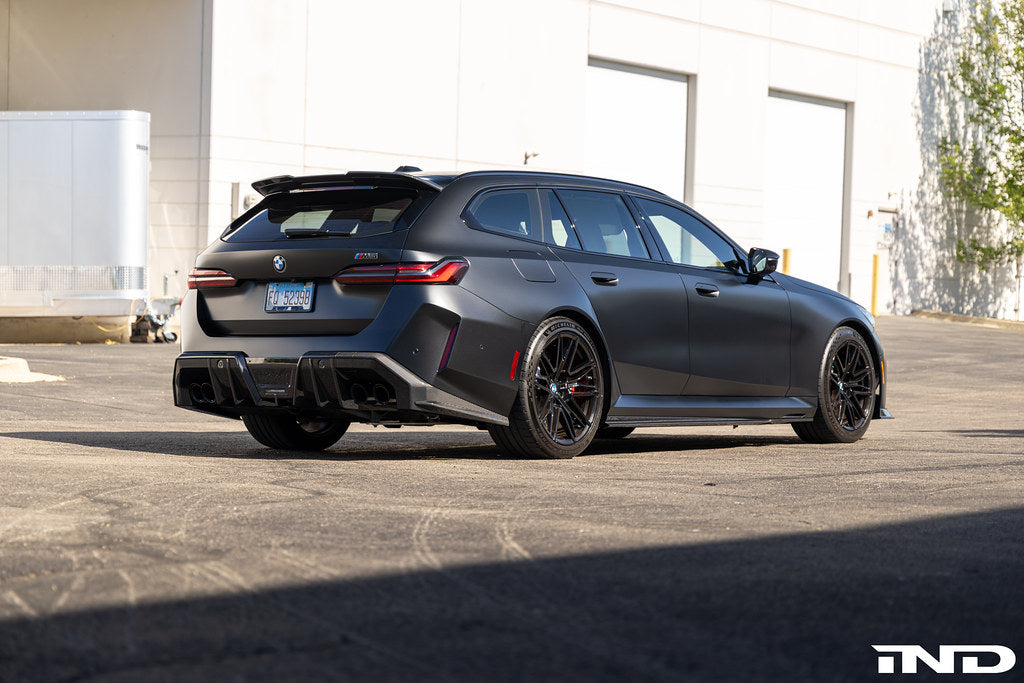 TREVORA G99 M5 Carbon Fiber Rear Roof Spoiler installed on a car, showcasing sleek exterior design and aerodynamic styling.