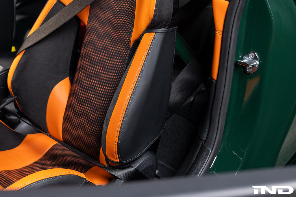 Wunderworks BMW M Carbon Bucket Seat upper bolster protector set installed in car interior, showing black carbon fiber protectors.
