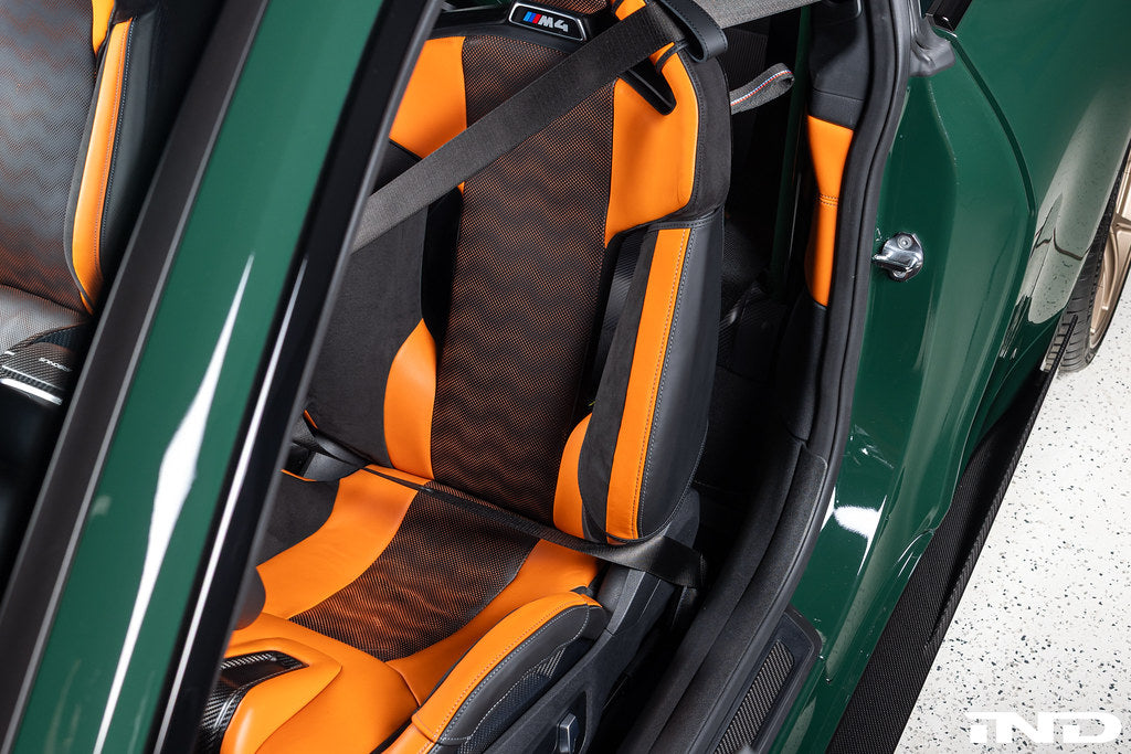 Wunderworks BMW M Carbon Bucket Seat upper bolster protector set installed in car interior, showcasing carbon fiber design and fit.