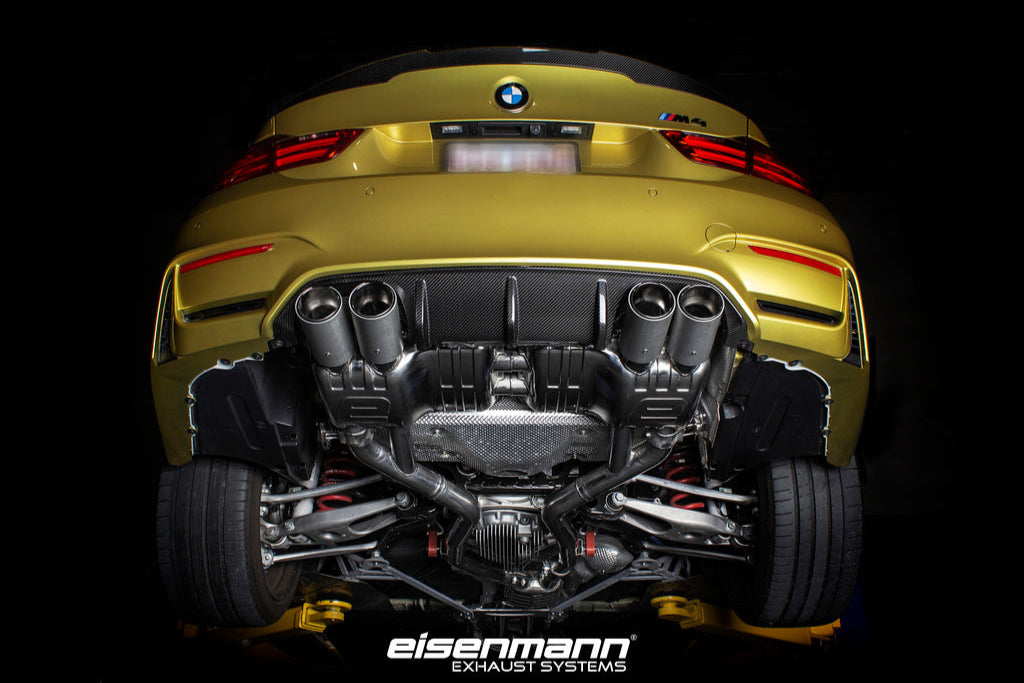 Eisenmann F8X M3/M4 performance valved exhaust system installed on a vehicle, showcasing polished exhaust tips and piping.