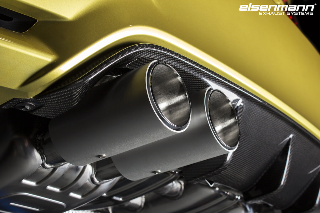 Eisenmann F8X M3 M4 performance exhaust system with valves, showing polished metal pipes and dual exhaust tips.