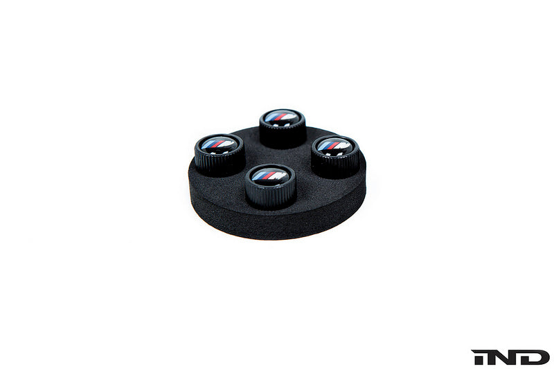 BMW OEM m logo black valve stem cap set - iND Distribution