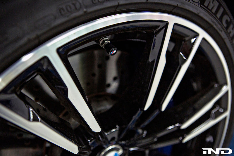 BMW OEM m logo black valve stem cap set - iND Distribution