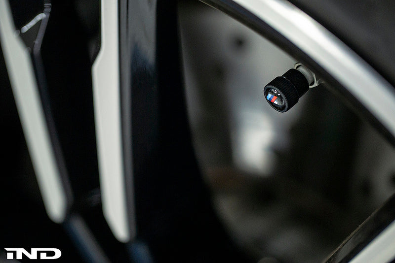 BMW OEM m logo black valve stem cap set - iND Distribution