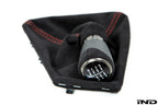 IND F87 M2 matte carbon stitched shift boot for 6-speed manual interior, featuring premium carbon and detailed stitching.