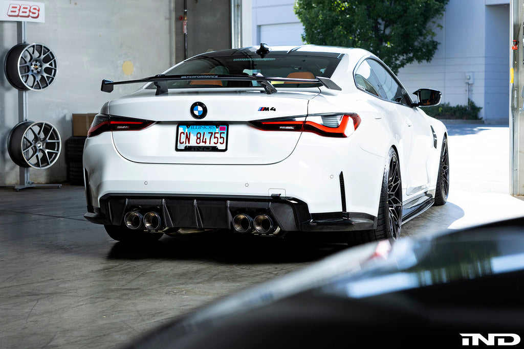 Eisenmann G8X M3/M4 performance exhaust system with valved design, showing polished metal pipes and exhaust tips.