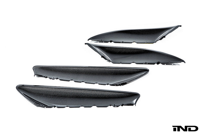 Alpha N F87 M2 carbon interior door card set with white background, showcasing sleek, lightweight carbon fiber panels for BMW M2.