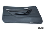 Alpha N F87 M2 carbon door card set for interior car customization, featuring sleek white finish and detailed craftsmanship.