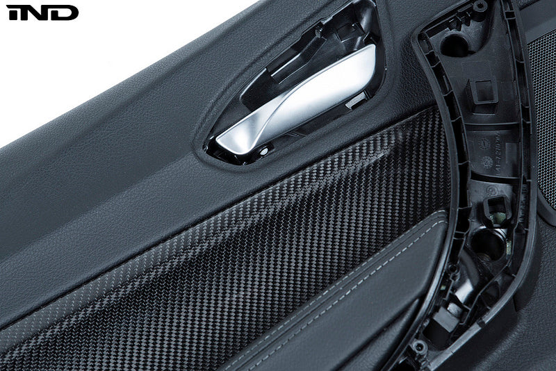 Alpha N F87 M2 carbon door card set for interior car customization, featuring sleek white finish on a clean background.