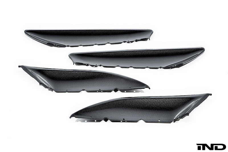 Alpha N F87 M2 carbon interior door card set with white background, showcasing sleek, lightweight carbon fiber material and detailed design.