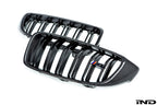 IND Carbon Fiber Front Grille Set for BMW F80 M3 and F82/F83 M4 featuring 2x2 carbon fiber surrounds with OEM BMW grille slats on a white background.