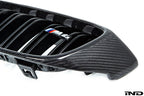 IND Carbon Fiber Front Grille Set for BMW F80 M3 and F82/F83 M4 featuring 2x2 carbon fiber surrounds with OEM BMW grille slats on a white background.