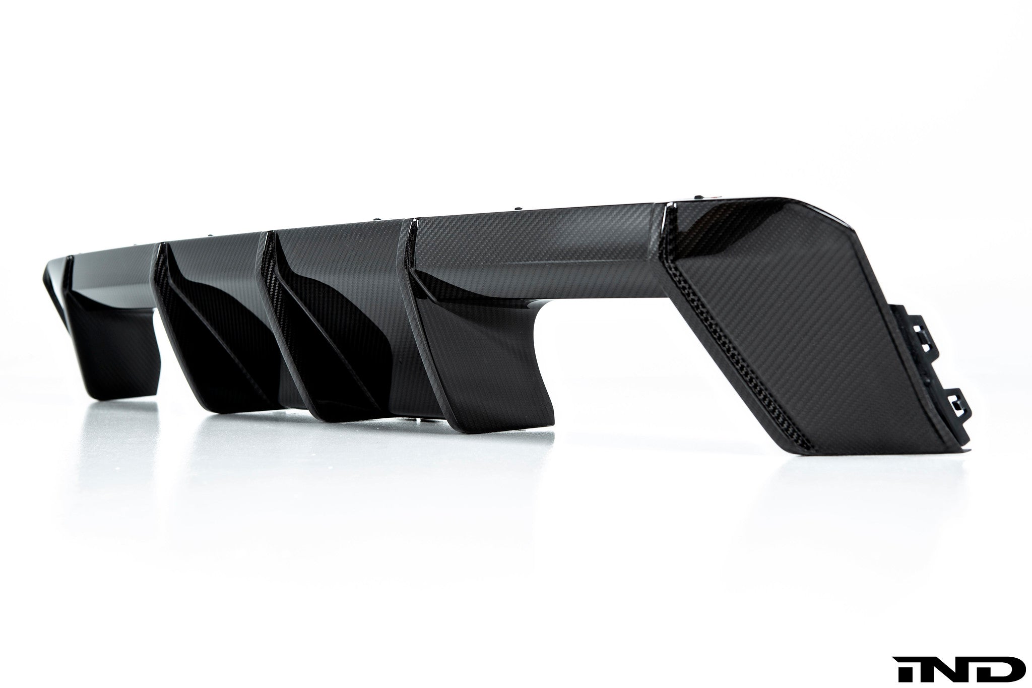 BMW M Performance G8X M3/M4 carbon rear diffuser showcasing sleek design and aerodynamic features for enhanced exterior style.