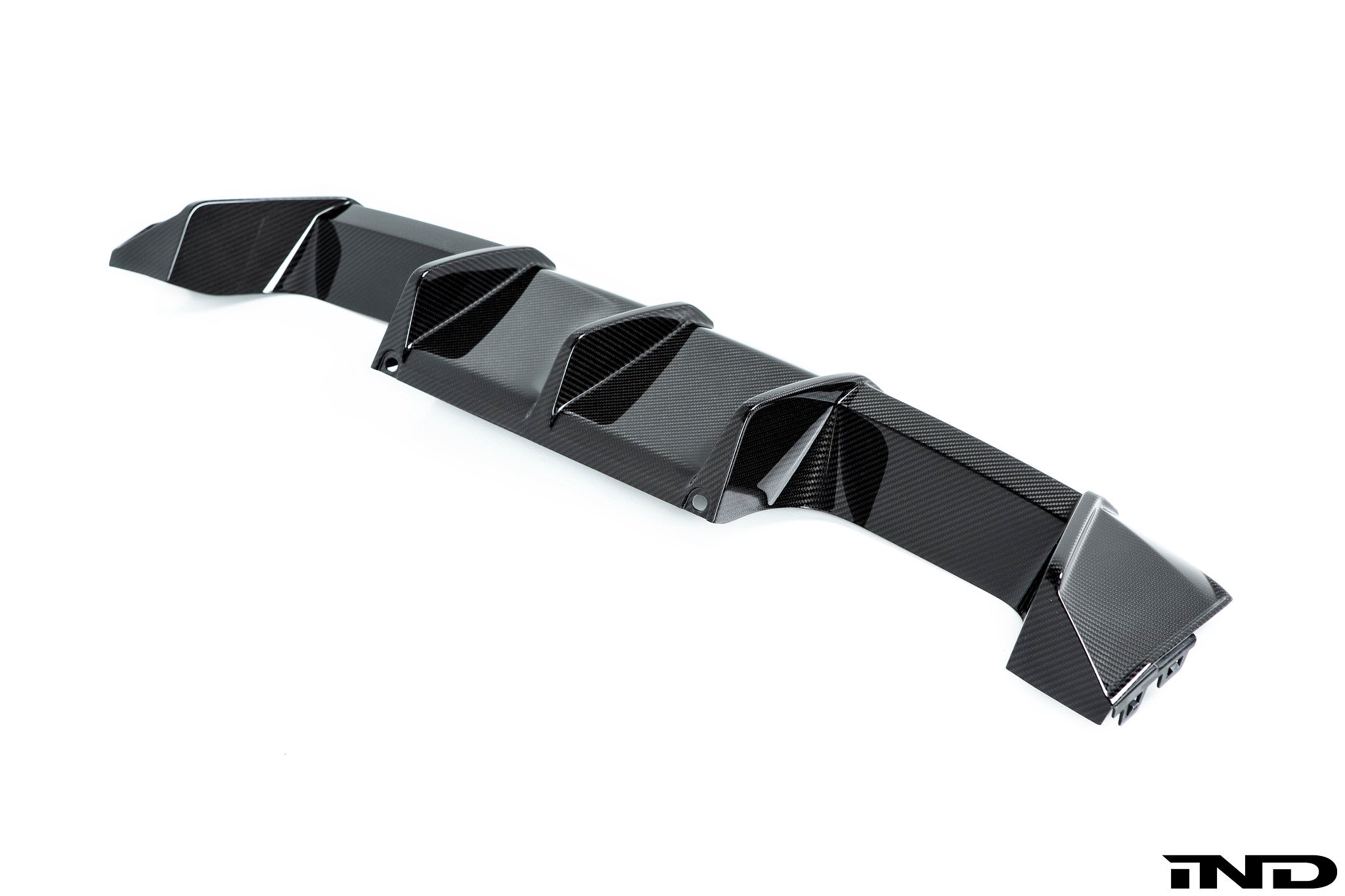 BMW M Performance G8X M3/M4 carbon rear diffuser showcasing sleek design and textured finish for enhanced aerodynamics.