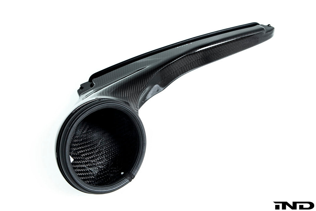 Rear view of Eventuri's carbon inlet duct for Audi 8V RS3 and 8S TTRS vehicles equipped with an APR throttlebody with the Eventuri stage 3 carbon intake system on white background
