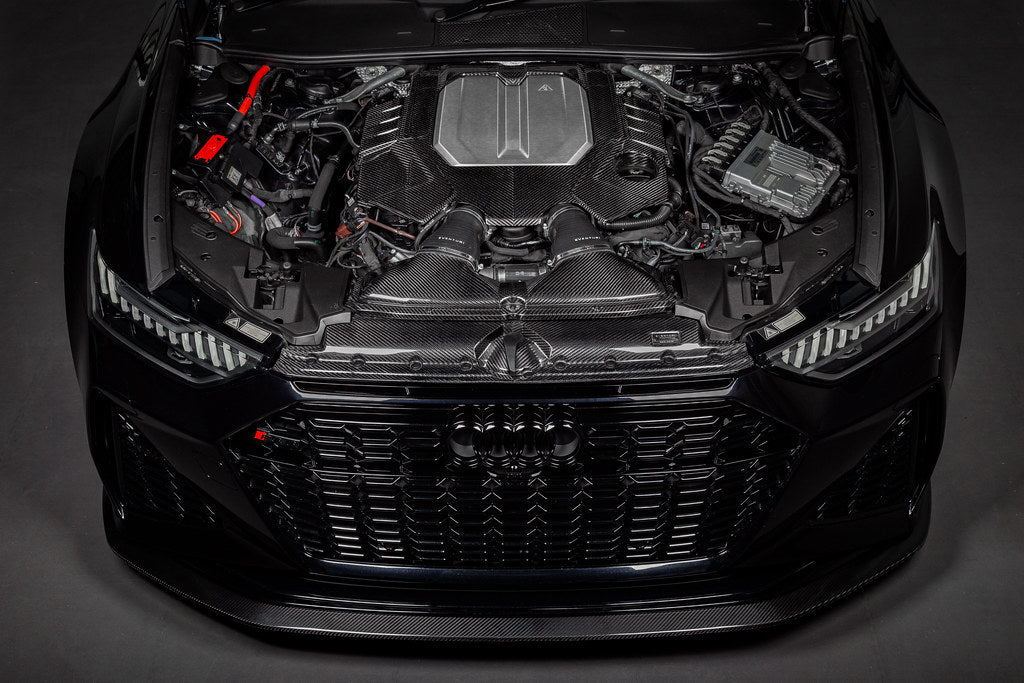 Eventuri black carbon engine cover installed on Audi C8 RS6 and RS7, showcasing sleek exterior design and high-quality craftsmanship.