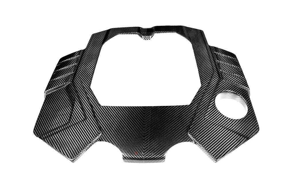 Eventuri black carbon engine cover for Audi C8 RS6 and RS7, exterior view showcasing sleek, glossy carbon fiber design.