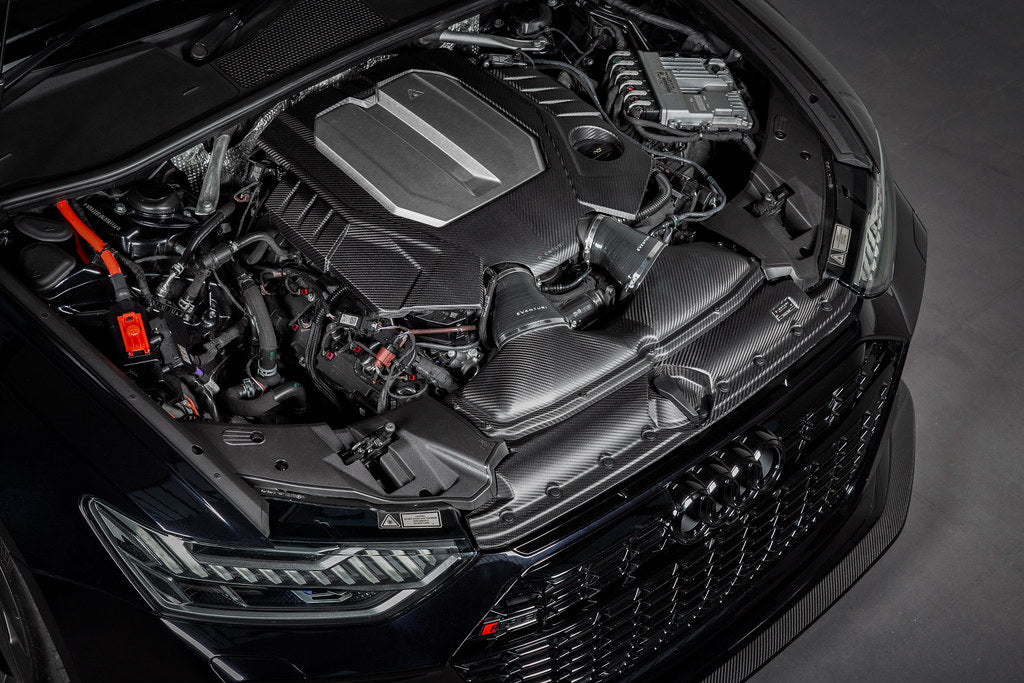 Eventuri black matte carbon engine cover installed on Audi C8 RS6 and RS7 exterior, showcasing sleek carbon fiber design.