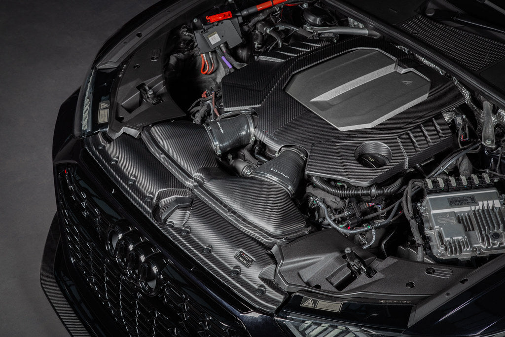 Eventuri black matte carbon engine cover installed on Audi C8 RS6 and RS7 exterior with sleek design.