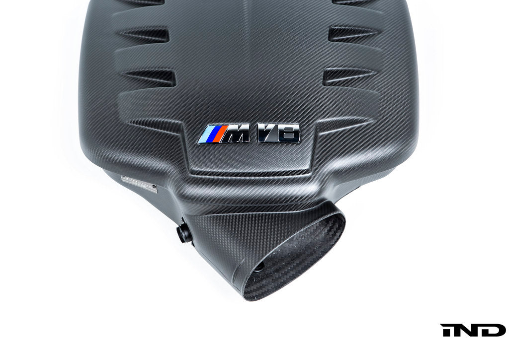 Eventuri black carbon fiber inlet plenum in matte finish for BMW E9X M3 with Eventuri branding on the side with close-up of front opening on a white background