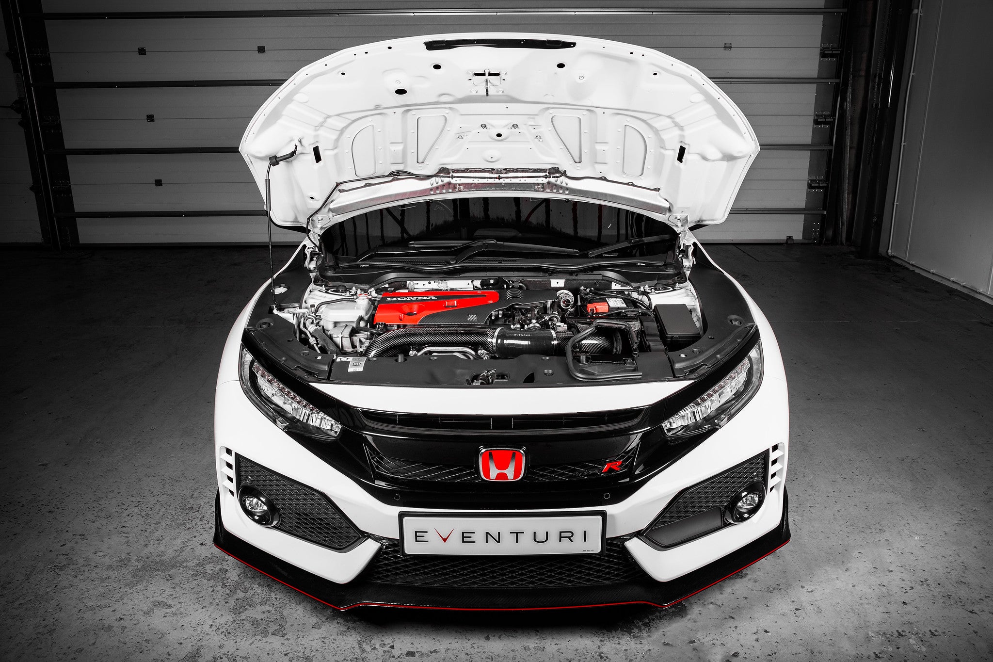 Eventuri FK8 Civic Type-R Black Carbon Intake System V2 installed in engine bay, showcasing sleek carbon fiber design and performance components.