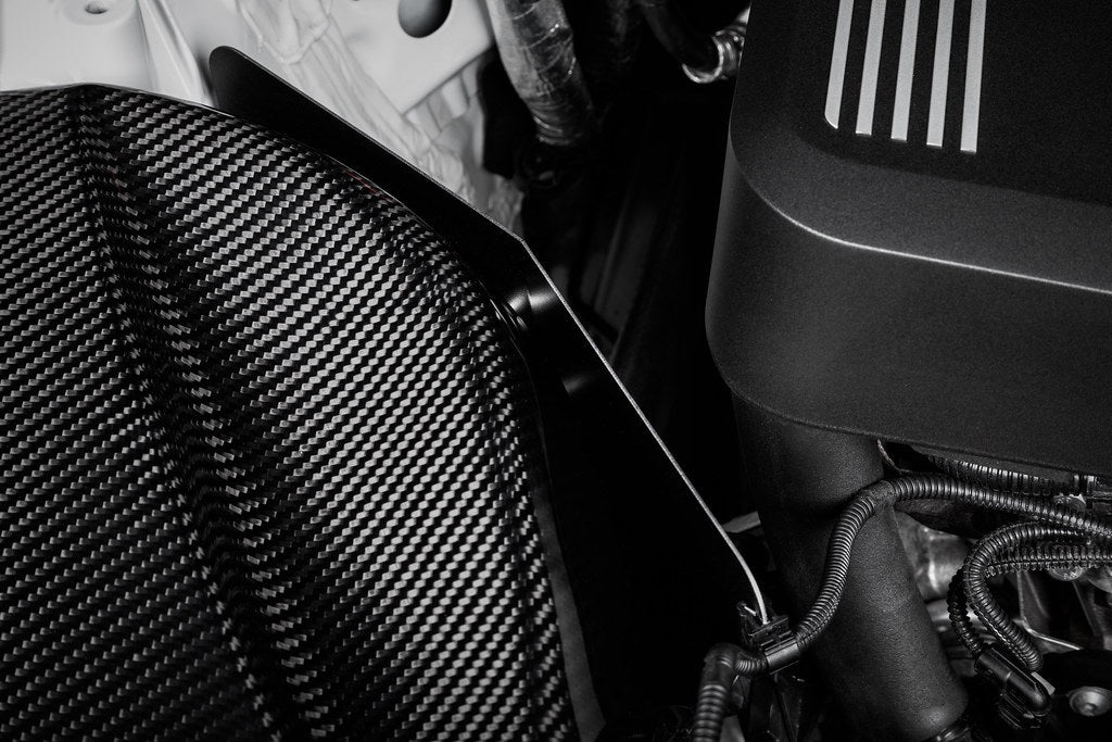 Close-up view of BMW G20 330i with Eventuri Carbon Intake System installed showing heatshield