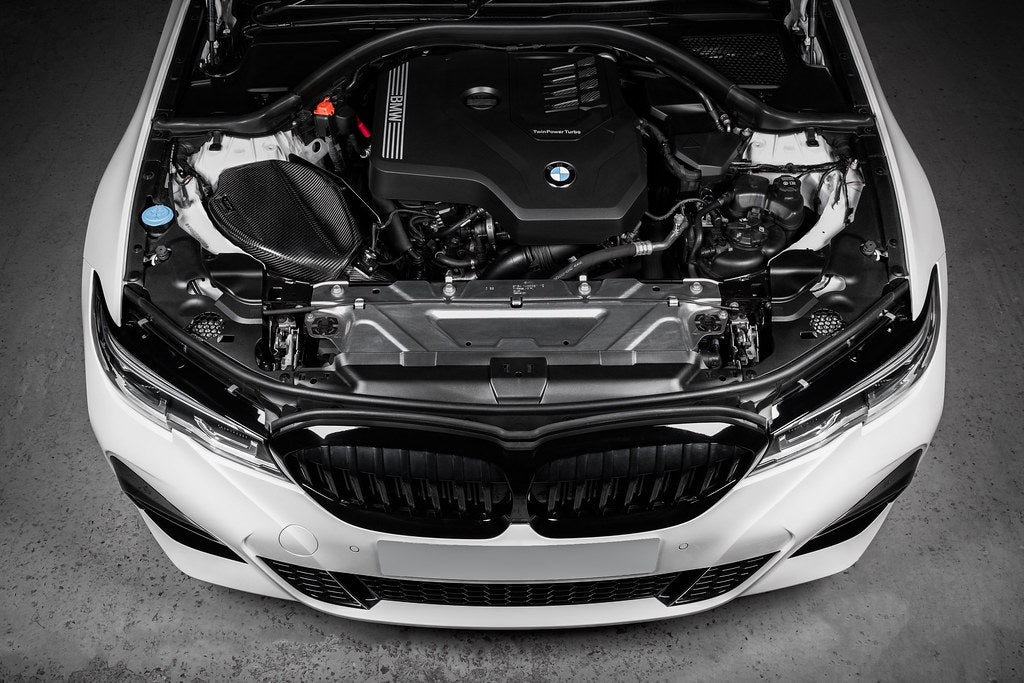 Eventuri BMW G20 3-Series B48 black carbon intake system installed, showcasing performance air intake for enhanced engine airflow.
