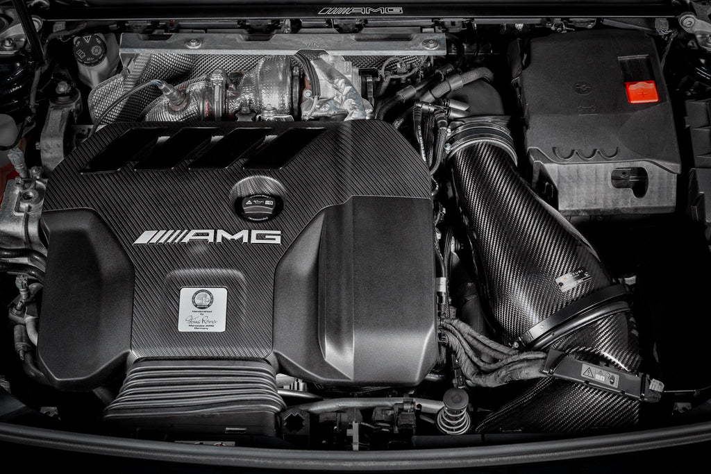 Eventuri black carbon intake system installed in a Mercedes AMG A45 CLA45, showcasing its sleek performance design.
