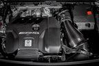 Eventuri black carbon intake system installed in a Mercedes AMG A45 CLA45, showcasing its sleek performance design.