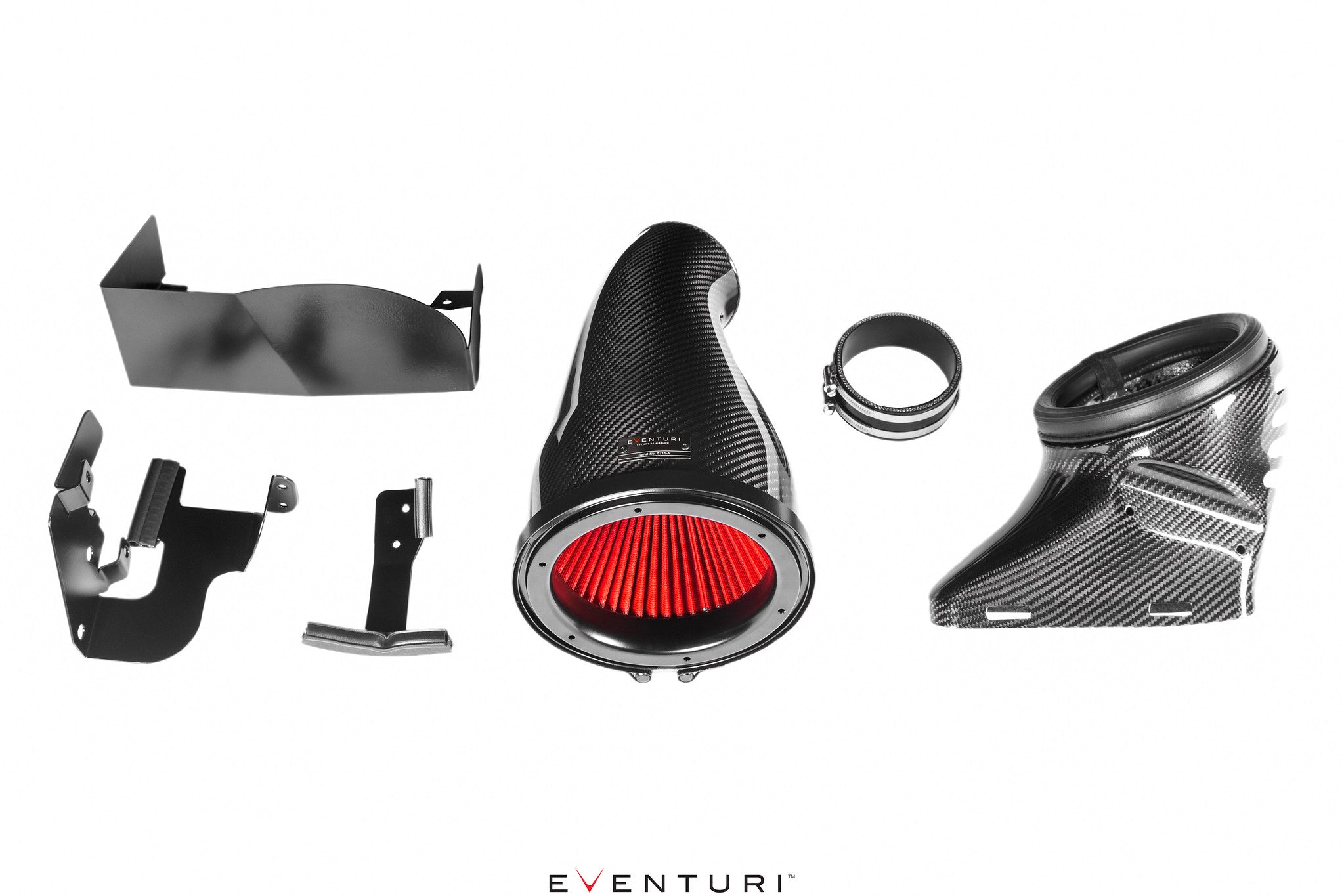 The image shows the components of the Eventuri Mercedes AMG A45 CLA45 Black Carbon Intake System, including a carbon fiber patented Venturi filter housing, bespoke high flow dry cone filter, carbon fiber inlet duct, laser cut stainless steel brackets, and silicon coupler with clamps.