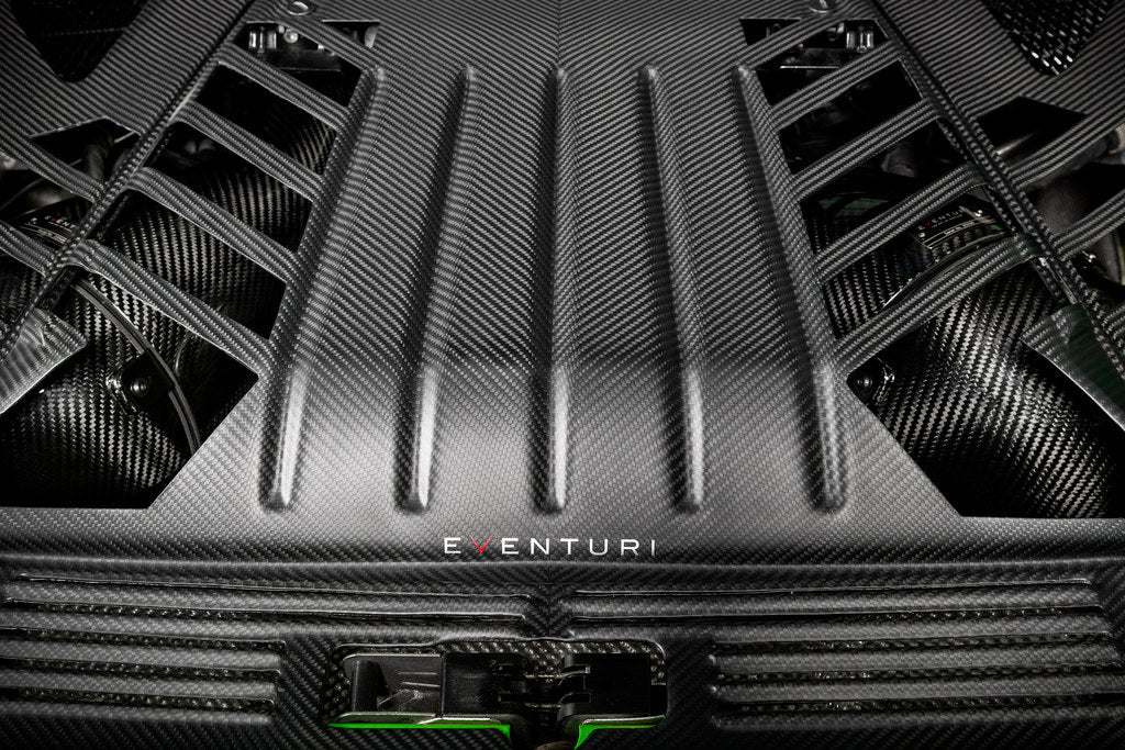 Eventuri Lamborghini Huracan black carbon engine cover set installed in the engine bay, showcasing performance car customization.