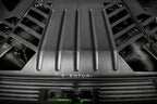 Eventuri Lamborghini Huracan black carbon engine cover set installed in the engine bay, showcasing performance car customization.
