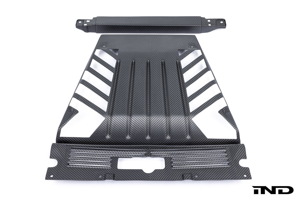 Eventuri Lamborghini Huracan black carbon engine cover set installed in engine bay, showcasing performance car detailing.