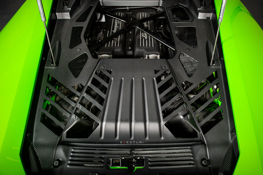 Eventuri Lamborghini Huracan black carbon engine cover set installed, showcasing sleek performance-enhancing engine bay accessories.