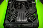 Eventuri Lamborghini Huracan black carbon engine cover set installed, showcasing sleek performance-enhancing engine bay accessories.