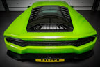 Eventuri Lamborghini Huracan black carbon engine cover set installed in the engine bay, showcasing performance carbon fiber design.