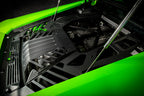 Eventuri Lamborghini Huracan black carbon engine cover set installed in the engine bay, showcasing performance automotive design.