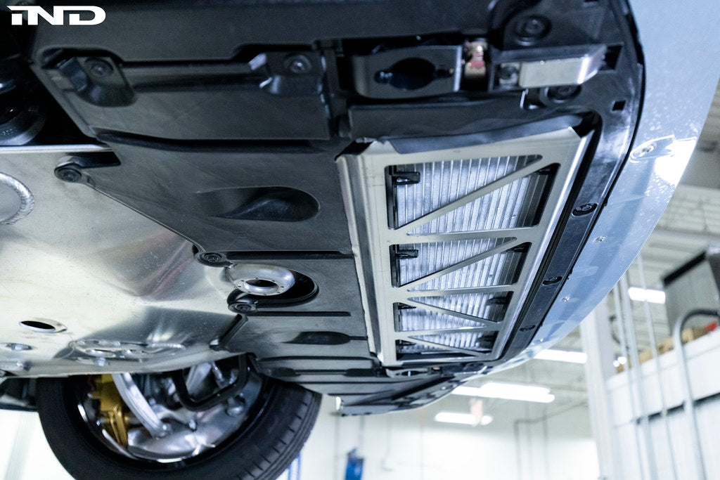 Fall Line Motorsports G8X M2 M3 M4 oil cooler guard exterior accessory in black with mesh design, for enhanced protection.