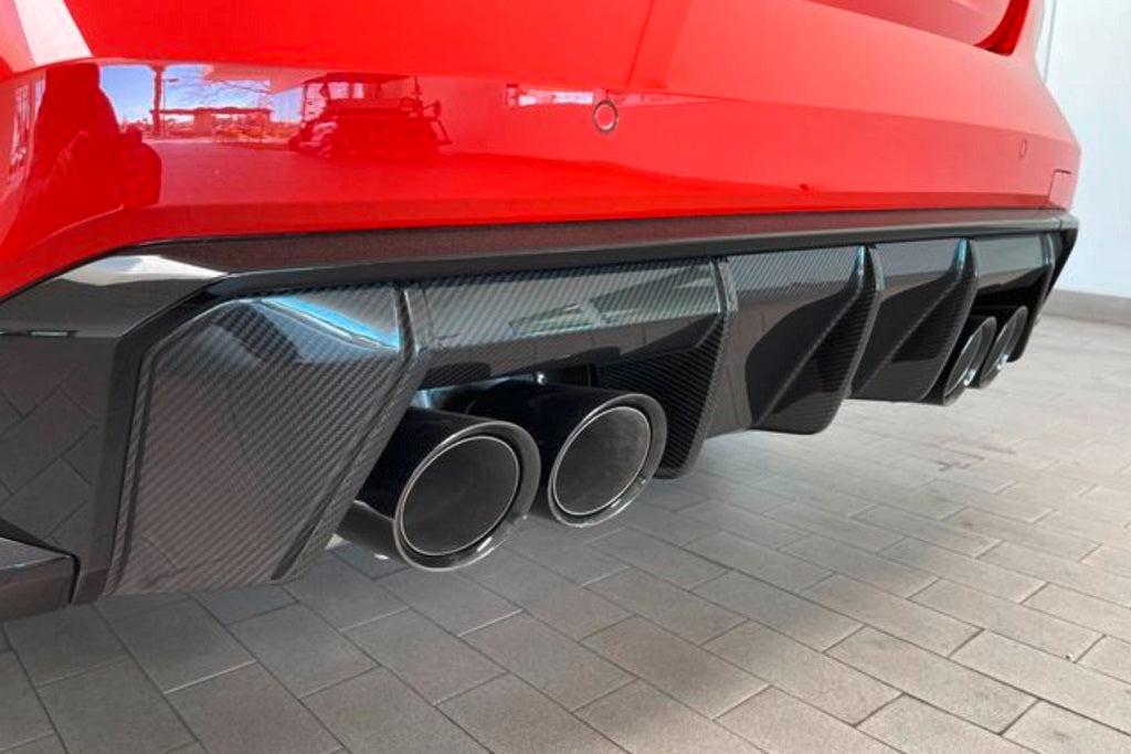 BMW M Performance G8X M3/M4 carbon rear diffuser showcasing sleek design and lightweight material for enhanced aerodynamics.